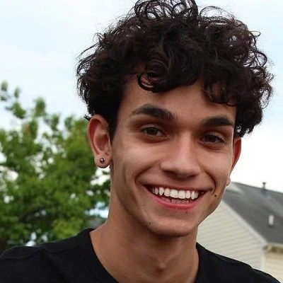 Portrait photo of Marcus Dobre smiling outdoors
