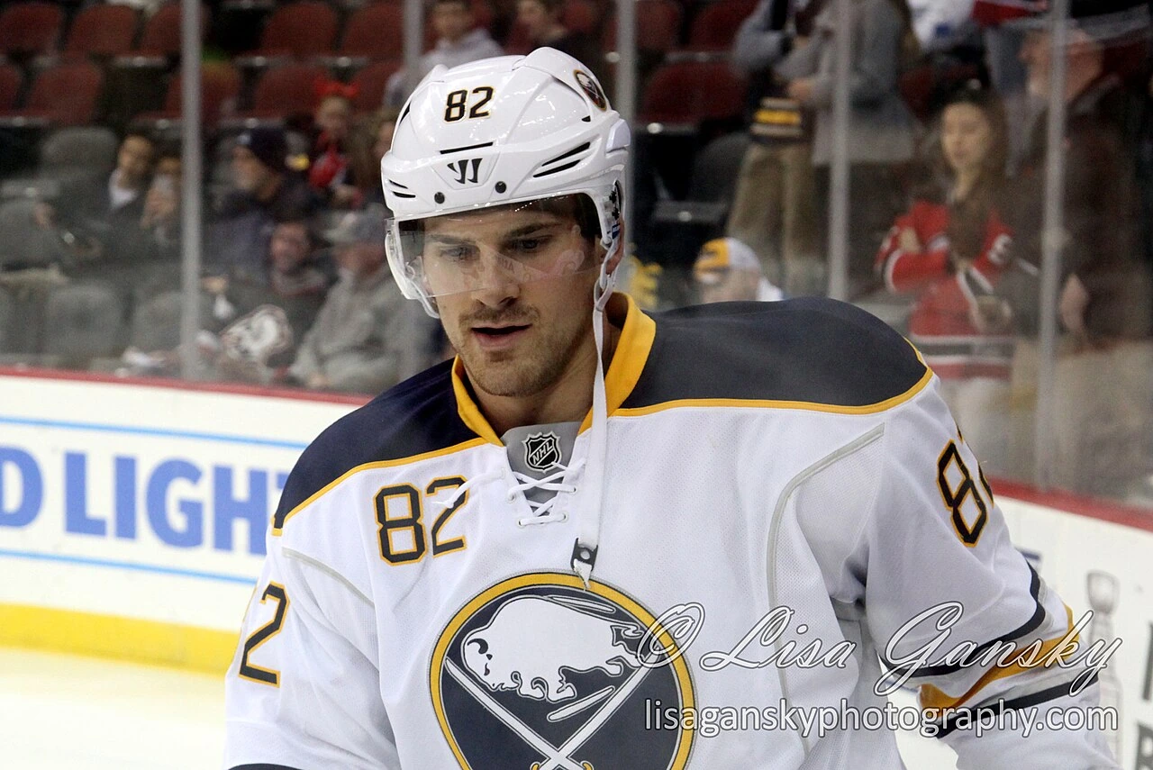 Marcus Foligno in a Buffalo Sabres uniform on the ice during a hockey game