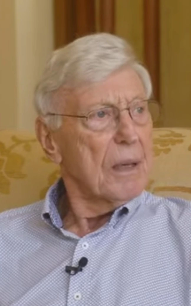 Bernard Marcus seated indoors in an interview-style portrait